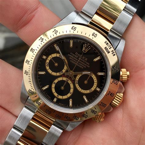 gold black face rolex daytona|daytona rolex price list.